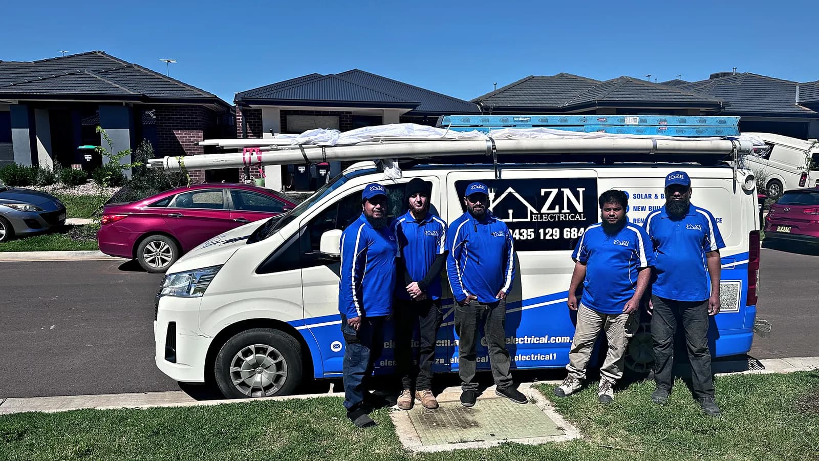 ZN Electrical team of licensed electricians standing beside their branded van